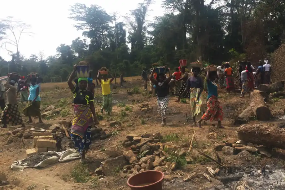 Women gathering building materials